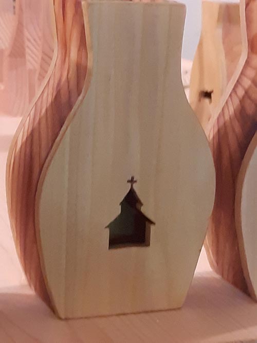 wooden vase with church cutout