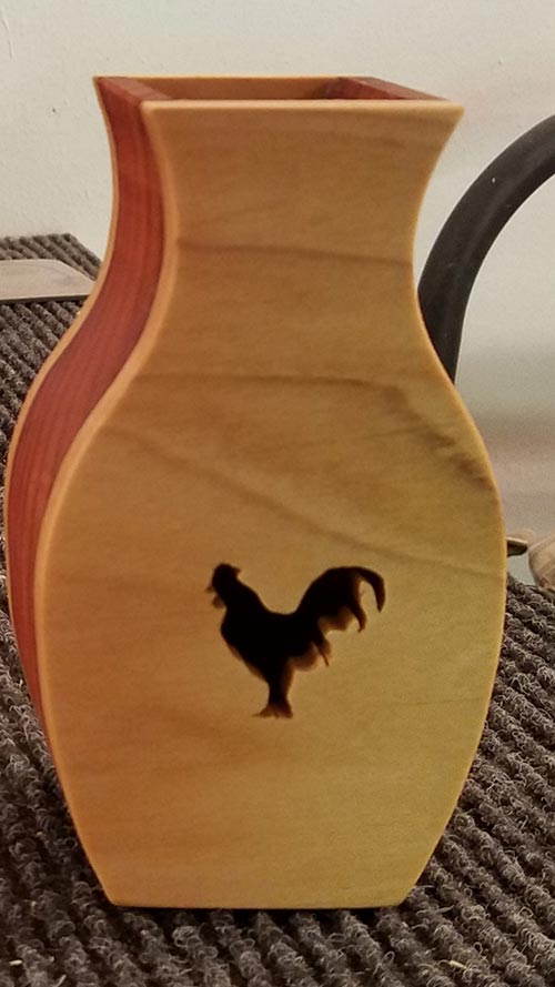 wooden vase with rooster cutout