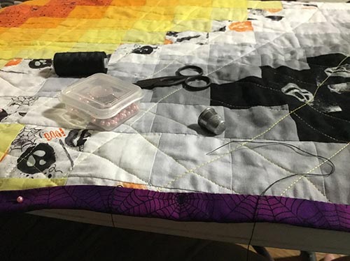 spooky quilt closeup with tools