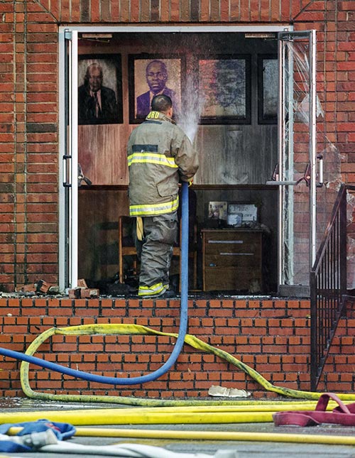 A firefighter responds to a fire at Mt. Pleasant Baptist Church.